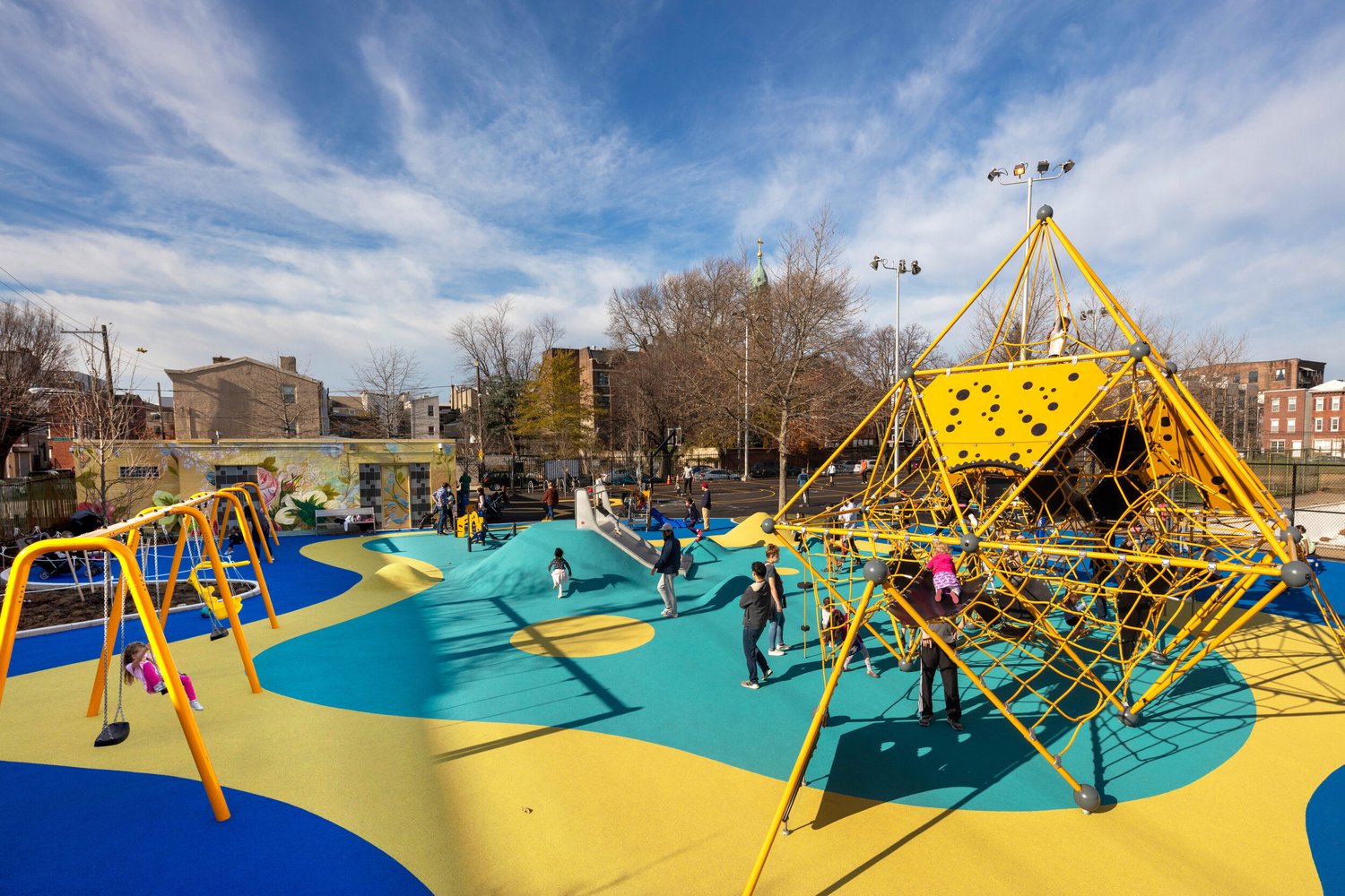 Children playing on a colorful Philadelphia playground